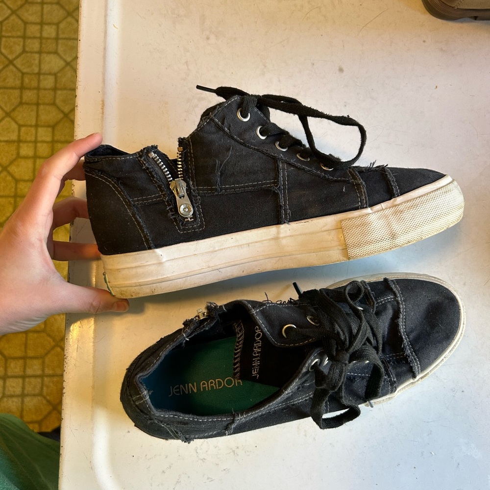 Distressed black sneakers